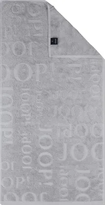A folded gray towel with a repeating pattern of the brand name 'Joop!' embossed on it. A small black label is visible on the top right corner.