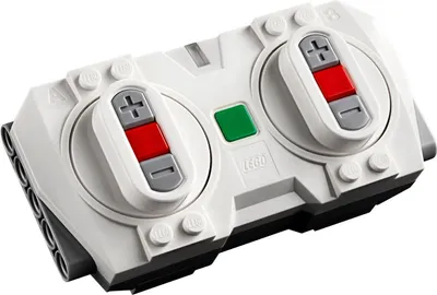 A close-up, angled view of a white LEGO remote control with gray and red buttons.