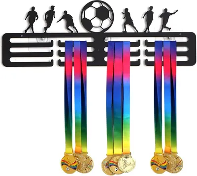 A black medal hanger with soccer player silhouettes and a soccer ball at the top, displaying three medals with rainbow-colored ribbons.