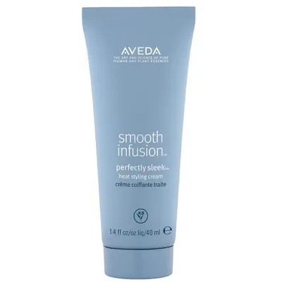 A close-up studio shot of a light blue tube of Aveda Smooth Infusion Perfectly Sleek Heat Styling Cream.