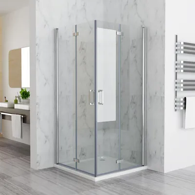 A modern bathroom with a glass shower enclosure.