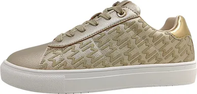 A side view of a single gold sneaker against a white background.