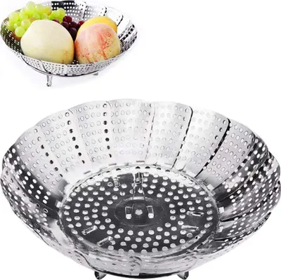 A stainless steel steamer basket is shown, with a smaller inset image showing the basket filled with fruit.