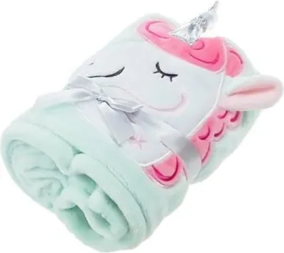 A rolled-up mint green unicorn blanket tied with a white ribbon.