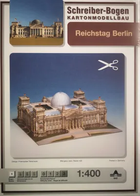 The image is a product shot of a cardboard model kit of the Reichstag building in Berlin.