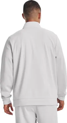 The back view of a man wearing a gray Under Armour fleece jacket.