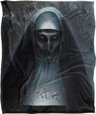 A blanket featuring a dark, ominous depiction of the character from the movie 'The Nun'.