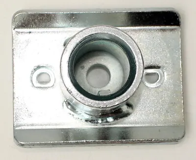 A close-up, top-down view of a metal lawnmower part.