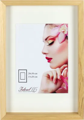 A framed picture of a woman with makeup and a flower in her hair.