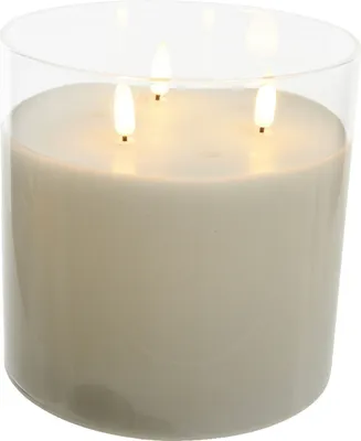 A three-wick LED candle in a clear glass holder.