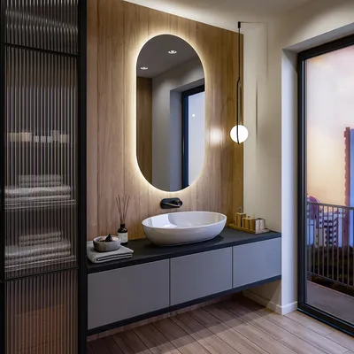 A modern bathroom with a vanity, sink, and illuminated mirror.