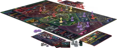 A tabletop board game with miniatures and game boards spread out on a white surface.
