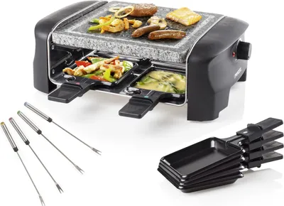 A mini raclette grill with a stone plate and accessories on a white background.