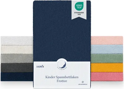 A display of multiple folded fitted sheets in various colors, with a prominent dark blue sheet in the center, showcasing a product label.