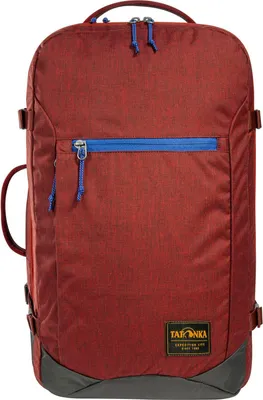 A red rucksack with blue zippers and gray accents is shown against a white background.