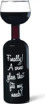 A wine bottle with a wine glass on top, filled with red wine.