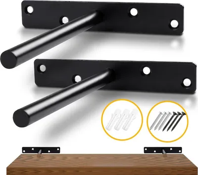 Two black floating shelf brackets are shown, with wall anchors and screws displayed in separate circles below. A wooden shelf is partially shown at the bottom, with a bracket attached to it.
