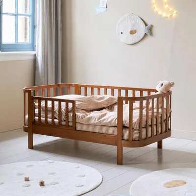 Produktbild von Petite Amélie Kinderbett Ovales Cocoon 70x140 cm - Walnuss – mit Lattenrost