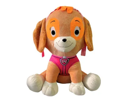 A plush toy of Skye from Paw Patrol sitting against a white background.