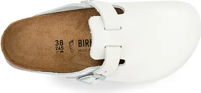 A top-down view of a white Birkenstock clog.