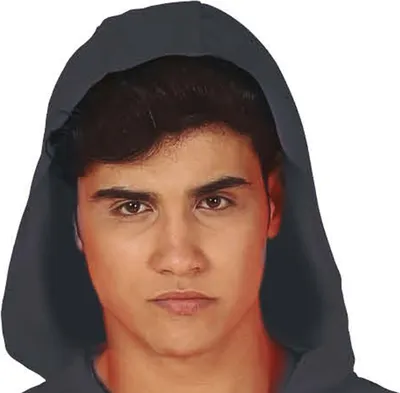 A close-up portrait of a young man wearing a dark gray hoodie.