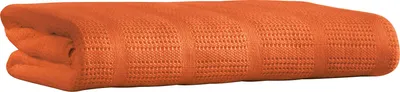 A folded orange blanket.