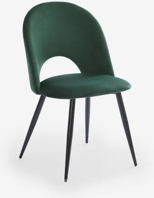 A single dark green velvet chair with black legs on a white background.