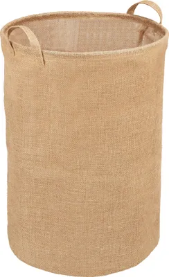 A plain, studio shot of a round, beige laundry basket made of burlap material.