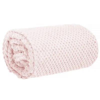 A rolled-up pink blanket with a textured pattern.