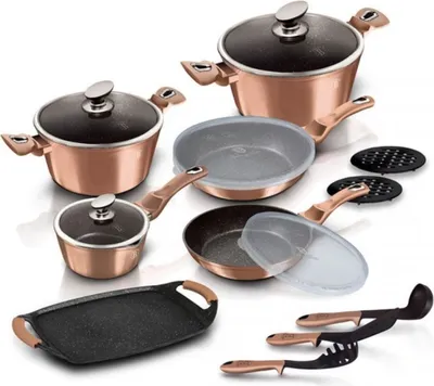 A collection of cookware and kitchen utensils arranged on a white background.