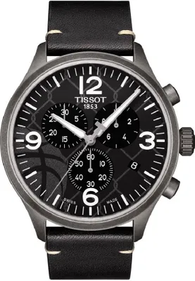 A close-up, front-facing view of a Tissot Chrono XL 3x3 Street Basketball Edition watch with a black dial and black leather strap.