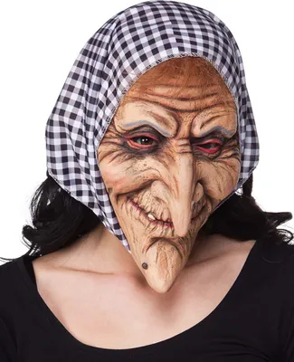 A close-up of a person wearing a witch mask and a black and white checkered headscarf.