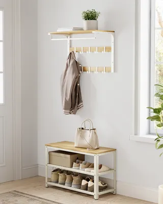 An entryway with a shoe bench and a coat rack.
