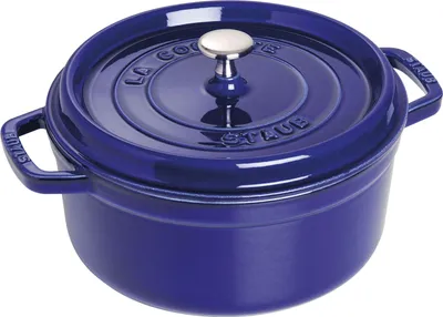 A blue Staub cast iron pot with a silver lid handle, shown from a slightly elevated angle against a white background.