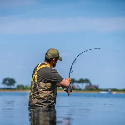 A person fishing in the water.