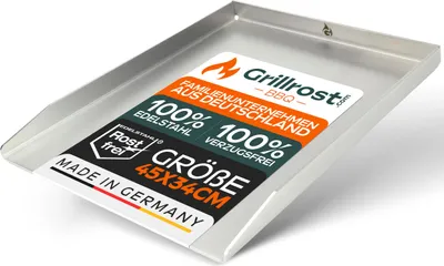 A stainless steel grill plate with a sticker showing product information.