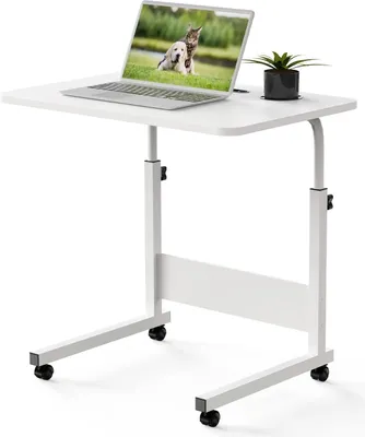 A white adjustable laptop table with a laptop and a small plant on it.