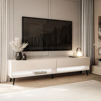 A modern living room with a TV stand and a large television.