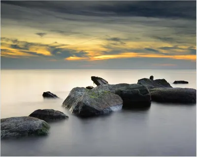 Produktbild von Wallario Poster - Mystische Felsen im Meer, Kunstdruck Größe: 40 x 50 cm