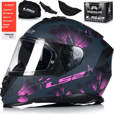 A product shot of a motorcycle helmet with accessories and packaging.