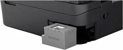 A close-up view of an Epson ink maintenance box being inserted into a printer.