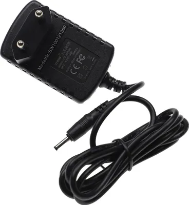 A black power adapter with a coiled black cable and a connector.