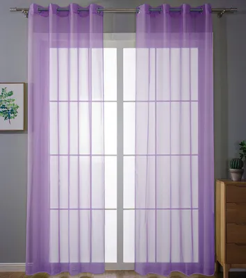 Two sheer purple curtains hang in front of a window with a grid pattern. A framed picture is on the left wall, and a wooden dresser with a potted plant is on the right.