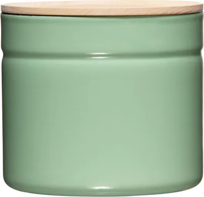 A green ceramic kitchen canister with a wooden lid.