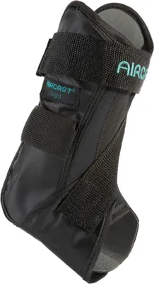 A black ankle brace with teal lettering is shown against a white background.