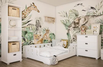 A child's bedroom with a jungle-themed mural and furniture.