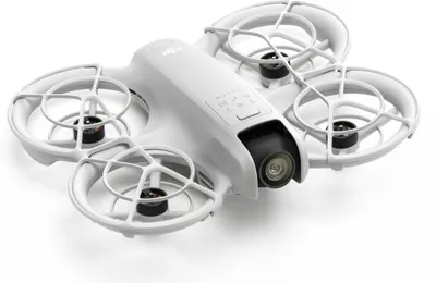 A white drone with four rotors and a camera is shown on a white background.
