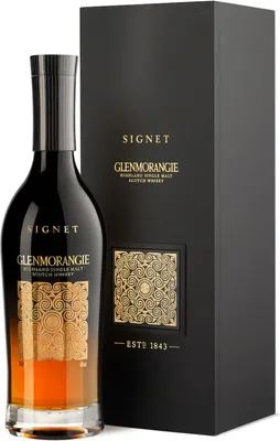 A bottle of Glenmorangie The Signet Highland Single Malt Scotch Whisky and its gift box are displayed against a white background.