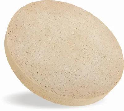 A round, beige, textured object, likely a sanding pad or sponge, is shown against a white background.