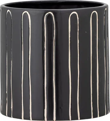 A black ceramic pot with white vertical stripes.